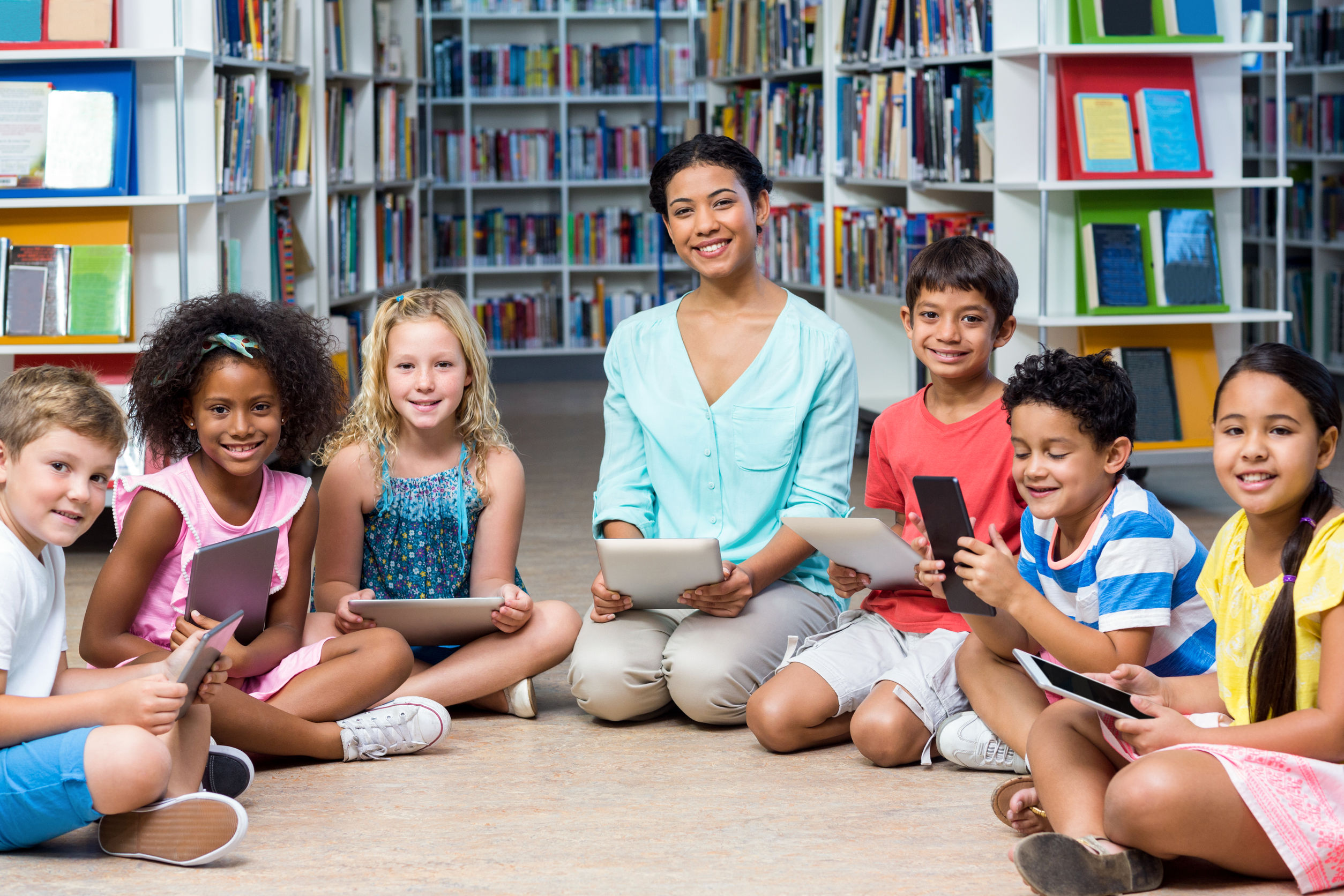 student data privacy - teacher with students in library