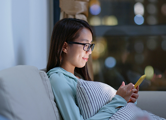 Pregnant mom checking cellphone